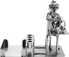 A metal figurine of a veterinarian examining a dog, with a desk and pen holder. Náhľad obrázku produktu