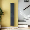 A modern interior with a vertical radiator against a yellow wall and stairs in the background. Anteprima dell’immagine prodotto