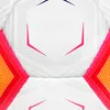 A close-up, symmetrical view of a white soccer ball with pink and red geometric patterns and yellow accents. Produktbild-Vorschau