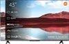 A television screen displaying a landscape with text overlays highlighting features. Voir les images du produit