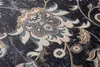 A close-up view of a patterned rug with floral motifs. Náhled obrázku produktu