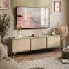A modern living room with a TV stand, TV, and decor. Produktbild-Vorschau