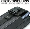 Close-up of a black phone case with a buckle closure, showing a phone partially inserted. Podgląd zdjęcia produktu