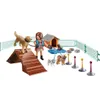 A Playmobil dog trainer set with various dogs, agility equipment, and a dog house. Produktbild-Vorschau