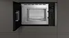 A top-down view of an open built-in microwave with its control panel visible. The interior of the microwave is clean and empty. Náhľad obrázku produktu