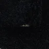 A close-up view of a black shaggy carpet. Produktbild-Vorschau