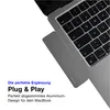 A close-up view of a MacBook laptop with a USB-C hub attached to its side, with marketing text overlayed on the left. Produktbild-Vorschau