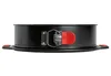 A side view of a black springform cake pan with a red latch and silver accents, set against a white background. Produktbild-Vorschau