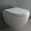 A modern wall-mounted toilet with a closed lid, set against a textured gray wall and a concrete floor. Produktbild-Vorschau