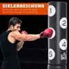 A man is punching a freestanding punching bag with numbered targets. Produktbild-Vorschau