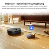 A robotic vacuum cleaner navigating a living room floor, avoiding a slipper. Text describes its obstacle avoidance technology. Produktbild-Vorschau