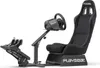 A black racing simulator seat with a steering wheel and pedals, shown against a white background. Produktbild-Vorschau