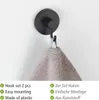 A black hook mounted on a white wall, holding a gray towel. Produktbild-Vorschau