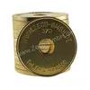 A stack of gold-colored tokens with text and numbers inscribed on them. Produktbild-Vorschau