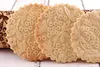 Close-up of intricately patterned cookies and a wooden rolling pin. Produktbild-Vorschau