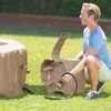 A man is connecting a hose to a portable hot tub. Náhľad obrázku produktu