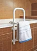 A white grab bar with a towel hanging on it, attached to the side of a bathtub. Náhled obrázku produktu