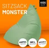 A light green beanbag chair shaped like a monster, with text overlays and a bright orange background. Anteprima dell’immagine prodotto