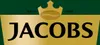 A close-up of the Jacobs brand logo with a crown and coffee bean emblem, set against a green and gold background. Podgląd zdjęcia produktu