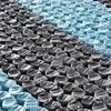 A close-up view of the inner workings of a mattress, showing rows of individual springs covered in fabric. Produktbild-Vorschau