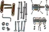A collection of hardware components, including hinges, bolts, screws, and wall anchors, arranged on a white background. Voir les images du produit