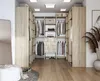 A well-organized walk-in closet with light wood cabinetry and various clothing items neatly displayed. Produktbild-Vorschau