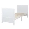 A white wooden baby bed frame with a slatted base, shown from a diagonal angle against a white background. Produktbild-Vorschau