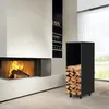 A modern living room with a fireplace and a black metal log holder filled with firewood. Produktbild-Vorschau