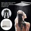 A woman showering under a large square showerhead. Anteprima dell’immagine prodotto