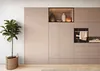 A modern kitchen with built-in cabinets and an oven, featuring decorative vases on a shelf and a potted plant. Produktbild-Vorschau