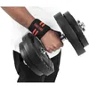 A person's arm wearing wrist wraps and holding a dumbbell. Náhľad obrázku produktu