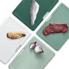 Four cutting boards with different food items on them, arranged diagonally on a white background. Anteprima dell’immagine prodotto