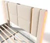 A close-up view of a beige upholstered bed frame with gold accents and LED lighting. Voir les images du produit