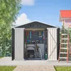 An open garden shed with tools and a bicycle inside, set against a backdrop of a house and trees. Produktbild-Vorschau