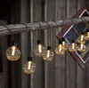 A string of decorative lights hanging from a wooden beam. Podgląd zdjęcia produktu