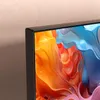 A close-up view of the corner of a TV screen displaying a colorful, abstract image. Produktbild-Vorschau