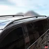 Close-up of roof racks on a black vehicle with a blurred mountain landscape in the background. Produktbild-Vorschau