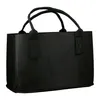 A black felt tote bag with handles is shown against a white background. Produktbild-Vorschau