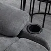 Close-up of a gray fabric armchair with a built-in cup holder. Podgląd zdjęcia produktu