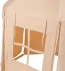A close-up view of a beige fabric tent with window openings. Produktbild-Vorschau