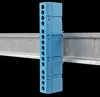 A blue terminal block is mounted on a metal rail against a black background. Produktbild-Vorschau