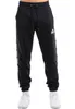 Pánske bežecké nohavice regular fit GRUTNESS Black/White Náhľad obrázku produktu 11