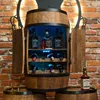 A wooden barrel-shaped wine cabinet with bottles of alcohol inside, set against a brick wall. Produktbild-Vorschau