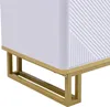 A close-up view of the bottom corner of a white TV cabinet with a gold metal frame. Náhľad obrázku produktu