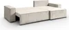 A cream-colored sectional sofa is shown from a slightly elevated side angle against a white background. The sofa appears to be in a partially extended state, possibly as a sofa bed. Produktbild-Vorschau