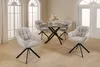 A dining set with a round table and four chairs in a room with arched windows. Produktbild-Vorschau