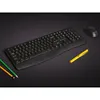 A black wireless keyboard and mouse set are displayed on a dark surface, along with two pencils and a yellow pen. Produktbild-Vorschau