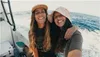 Two women smiling on a boat in the ocean. Podgląd zdjęcia produktu