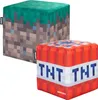 Two Minecraft-themed ottomans, one resembling a grass block and the other TNT, are displayed against a white background. Podgląd zdjęcia produktu