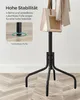 A close-up of the base of a black coat rack, highlighting its adjustable feet and stable design, with a handbag and clothes hanging from the top. Náhled obrázku produktu